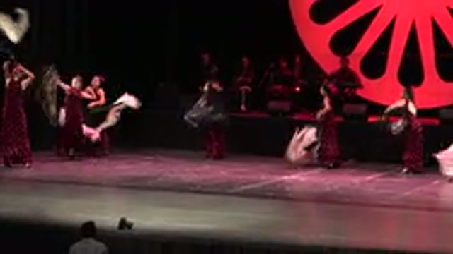 CABO SAN LUCAS MEXICO-2019: Women In Purple Dresses Dancing On A Stage Using