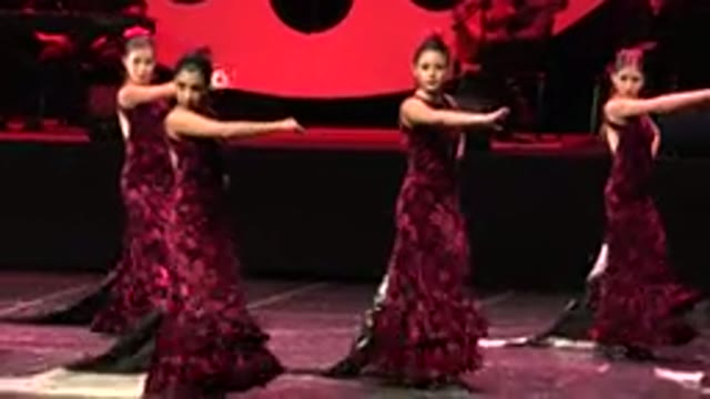 CABO SAN LUCAS MEXICO-2019: A Group Of Young Girls Wearing Red Dresses Perform A