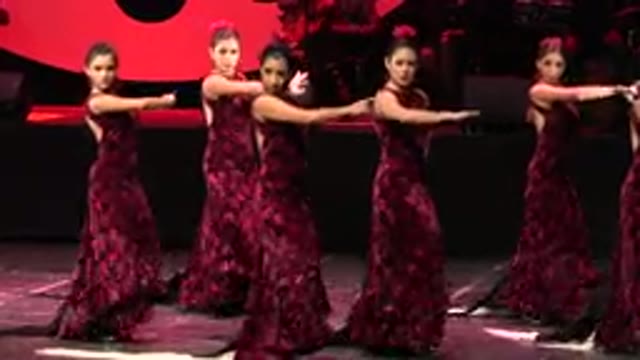 CABO SAN LUCAS MEXICO-2019: Group Of Dancers In Maroon Dress Finish Presenting
