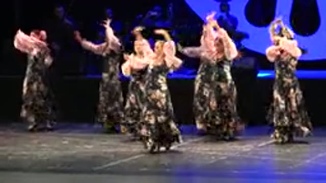 CABO SAN LUCAS MEXICO-2019: Women Wearing Grey And White Dresses Perform Dance
