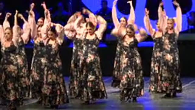 CABO SAN LUCAS MEXICO-2019: Adult Women in Black and Pink Dresses Dancing Energetically