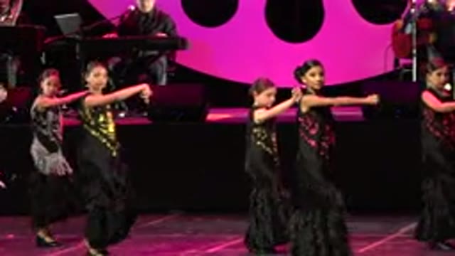 CABO SAN LUCAS MEXICO-2019: Women Wearing Black Pink And Gold Dresses Perform