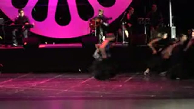 CABO SAN LUCAS MEXICO-2019: Dancers On Stage Doing A Performance In Dresses And Fans