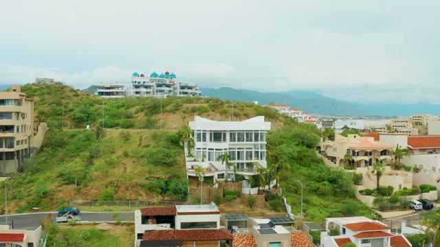 SAN JOSE DEL CABO BCS MEXICO-2021: Hillside Buildings Under Clearing Sky