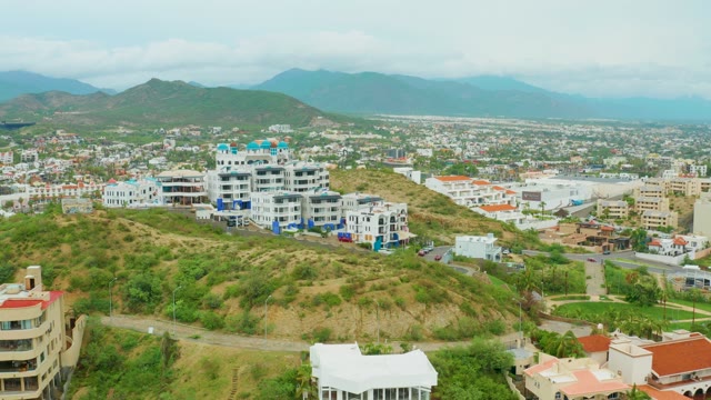 SAN JOSE DEL CABO BCS MEXICO-2021: Hilly Urban Landscape with Drifting Clouds