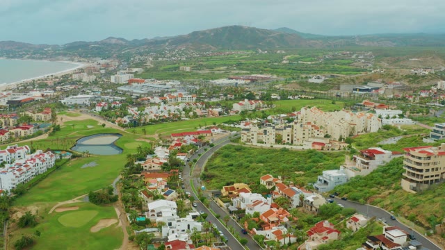 SAN JOSE DEL CABO BCS MEXICO-2021: Coastal Road with Moving Vehicles and Golf Course