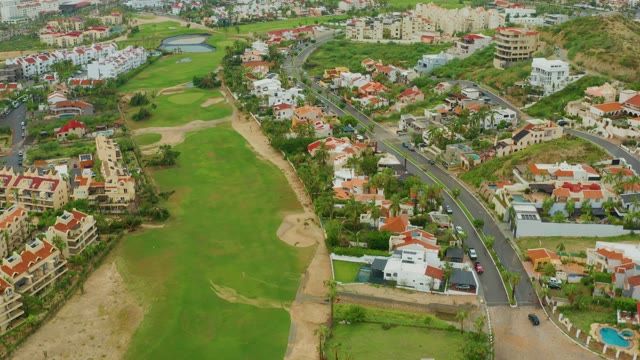 SAN JOSE DEL CABO BCS MEXICO-2021: Golf Course with Red-Roofed Homes and Coastal View