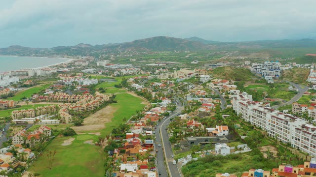SAN JOSE DEL CABO BCS MEXICO-2021: Coastal Residential Area and Road with Moving Car
