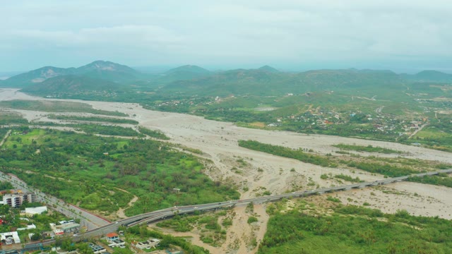 SAN JOSE DEL CABO BCS MEXICO-2021: Flooded River and Urban Development Near Hills