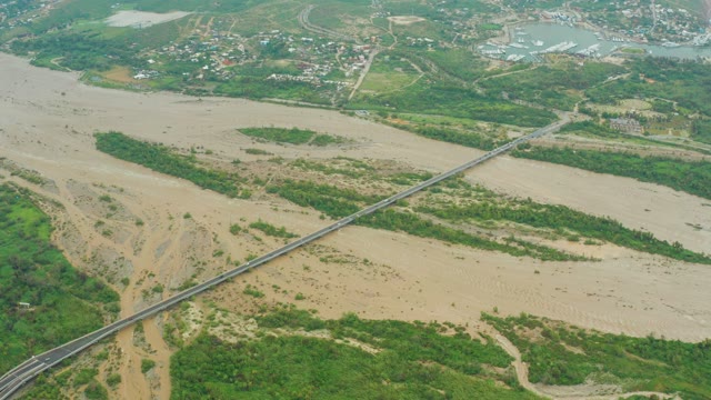 SAN JOSE DEL CABO BCS MEXICO-2021: Flooded River Receding with Bridge
