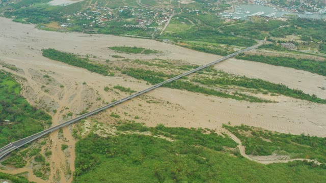 SAN JOSE DEL CABO BCS MEXICO-2021: Muddy River Current Under Long Bridge