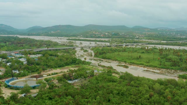 SAN JOSE DEL CABO BCS MEXICO-2021: Muddy River Flowing Through Lush Valley