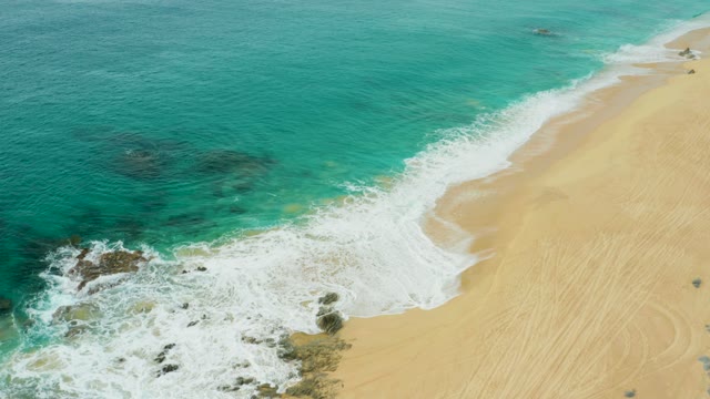 LAGUNA BEACH LOS CABOS BCS MEXICO-2021: Ocean Waves Rolling Onto Sandy Beach