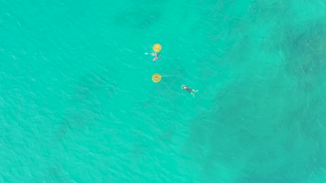 LAGUNA BEACH LOS CABOS BCS MEXICO-2021: People Swimming with Yellow Buoys in Clear Ocean Water