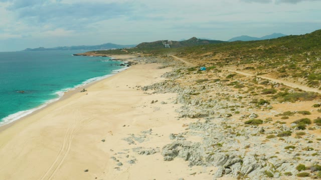LAGUNA BEACH LOS CABOS BCS MEXICO-2021: Coastal Beach with Vehicle Traveling on Path