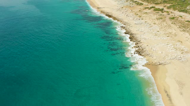 LAGUNA BEACH LOS CABOS BCS MEXICO-2021: Waves Rolling Onto Sandy and Rocky Beach