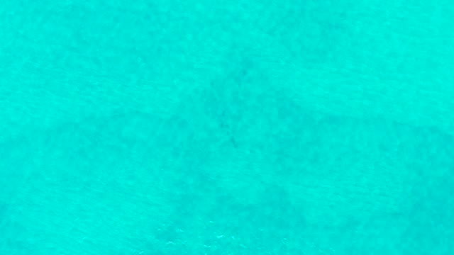 LAGUNA BEACH LOS CABOS BCS MEXICO-2021: Shifting Patterns on Clear Turquoise Ocean Surface