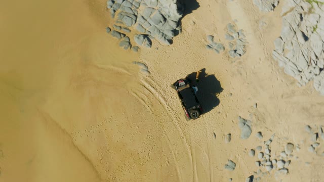 LAGUNA BEACH LOS CABOS BCS MEXICO-2021: SUV Moving Through Sandy Rocky Terrain