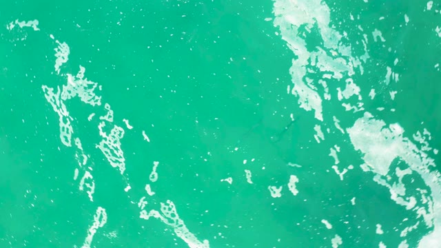 LAGUNA BEACH LOS CABOS BCS MEXICO-2021: Moving White Foam on Turquoise Ocean Surface