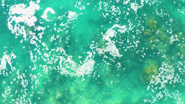 LAGUNA BEACH LOS CABOS BCS MEXICO-2021: Shifting White Foam on Turquoise Water Surface