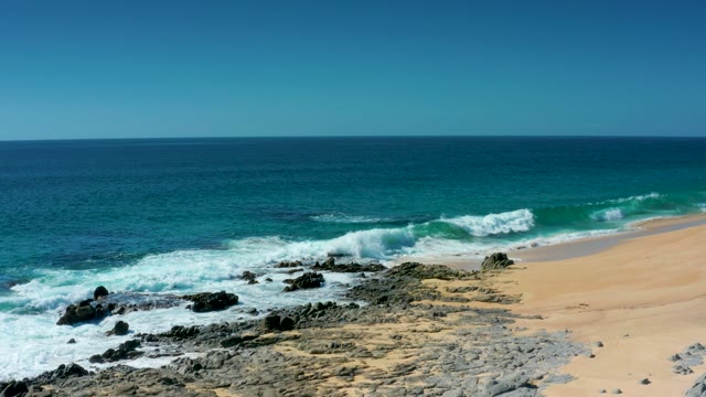 LAGUNA BEACH LOS CABOS BCS MEXICO-2021: Ocean Waves Crashing on Rocky Beach Shore