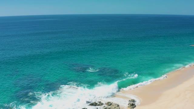 LAGUNA BEACH LOS CABOS BCS MEXICO-2021: Waves Crashing on Rocky Beach Shoreline