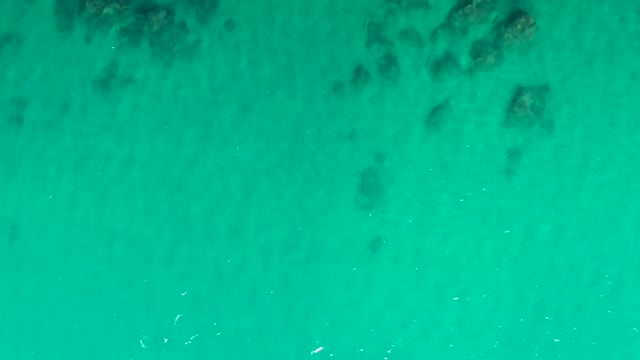 LAGUNA BEACH LOS CABOS BCS MEXICO-2021: Shallow Ocean Water with Submerged Rocks and Gentle Waves