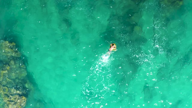 LAGUNA BEACH LOS CABOS BCS MEXICO-2021: Person Swimming in Clear Turquoise Ocean Water