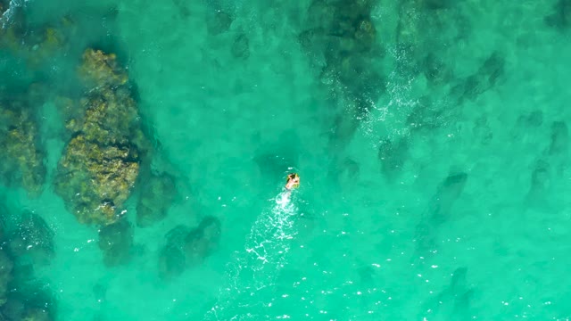 LAGUNA BEACH LOS CABOS BCS MEXICO-2021: Person Swimming in Clear Turquoise Ocean Water
