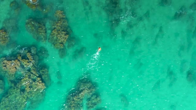 LAGUNA BEACH LOS CABOS BCS MEXICO-2021: Swimmer in Clear Turquoise Water with Underwater Rocks