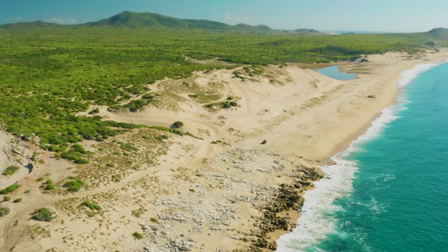 LAGUNA BEACH LOS CABOS BCS MEXICO-2021: Coastal Dunes and Ocean with Shifting Clouds