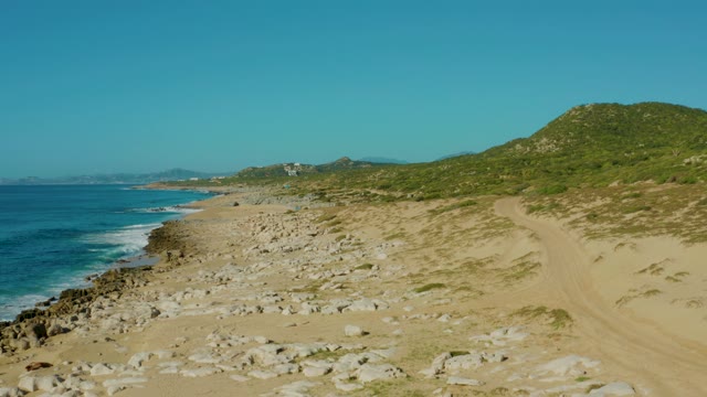 LAGUNA BEACH LOS CABOS BCS MEXICO-2021: Coastal Beach with Rocky Shore and Green Hill