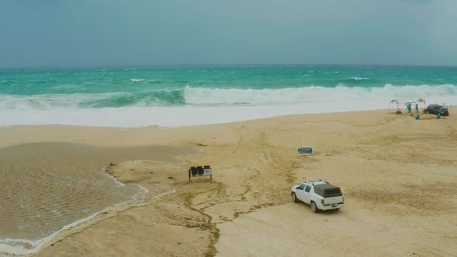 DREAMS RESORT LOS CABOS BCS MEXICO-2021: Beach Waves and Moving Vehicle on Sandy Shore