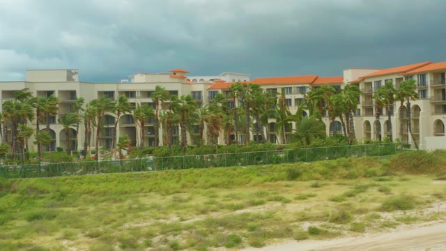 DREAMS RESORT LOS CABOS BCS MEXICO-2021: Beachfront Hotel with Palm Trees and Cloudy Sky