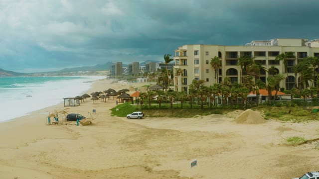 DREAMS RESORT LOS CABOS BCS MEXICO-2021: Beach Vehicle Moving with Stormy Sky
