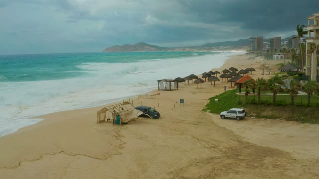 DREAMS RESORT LOS CABOS BCS MEXICO-2021: Sandy Beach with Crashing Waves and Overcast Sky