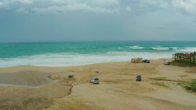 DREAMS RESORT LOS CABOS BCS MEXICO-2021: Sandy Beach with Parked Cars and Moving Vehicle