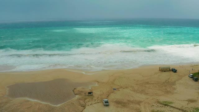 DREAMS RESORT LOS CABOS BCS MEXICO-2021: Waves Breaking on Sandy Beach with Parked Vehicles