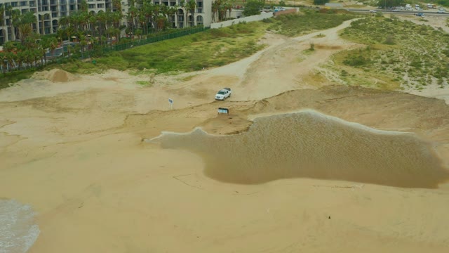 DREAMS RESORT LOS CABOS BCS MEXICO-2021: Beach Water Puddle Shifting on Sandy Shore