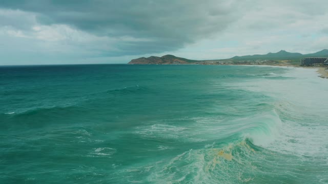 DREAMS RESORT LOS CABOS BCS MEXICO-2021: Ocean Waves Rolling Toward Sandy Shore