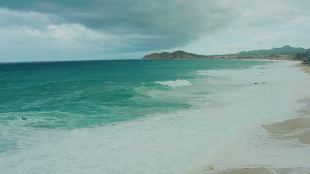 DREAMS RESORT LOS CABOS BCS MEXICO-2021: Ocean Waves Crashing on Sandy Shore