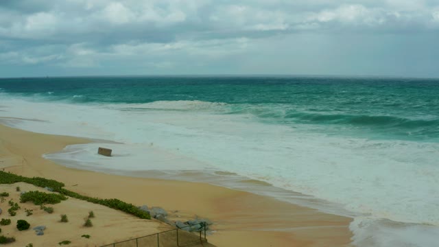 DREAMS RESORT LOS CABOS BCS MEXICO-2021: Waves Advancing on Sandy Beach From Elevated Vantage