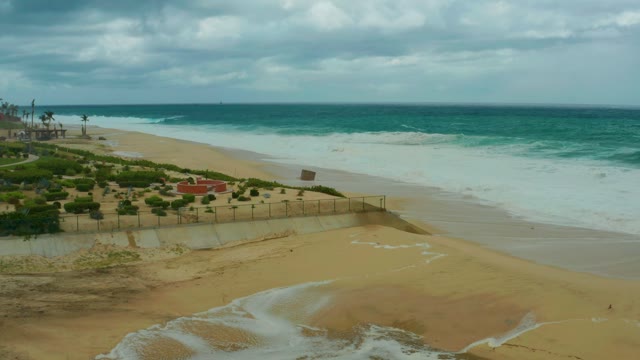 DREAMS RESORT LOS CABOS BCS MEXICO-2021: Ocean Waves and Runoff Flowing Over Sandy Beach