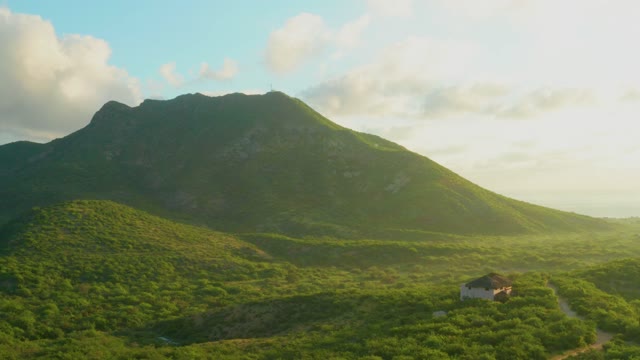 CABO PULMO BCS MEXICO-2021: Green Mountain Slope with House and Water Tank