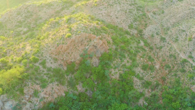 CABO PULMO BCS MEXICO-2021: Hilly Landscape with Green Shrubs and Rocky Outcrops
