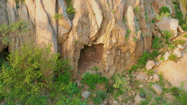 CABO PULMO BCS MEXICO-2021: Cave in Rocky Outcrop with Lush Greenery