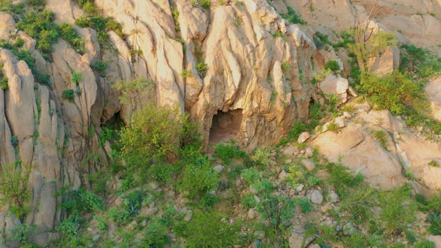 CABO PULMO BCS MEXICO-2021: Rocky Cave and Vegetation in Arid Terrain