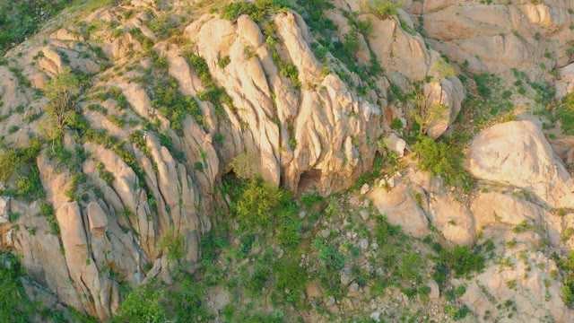 CABO PULMO BCS MEXICO-2021: Rocky Hillside with Sparse Green Vegetation