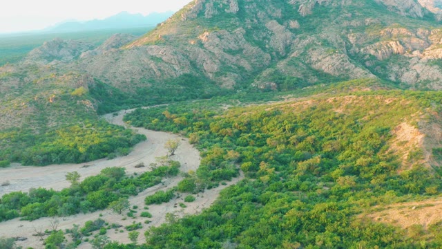 CABO PULMO BCS MEXICO-2021: Winding Dirt Road Through Mountainous Green Valley