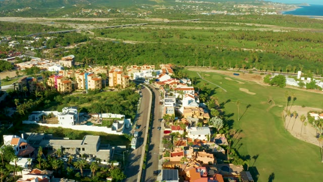 SAN JOSE DEL CABO BCS MEXICO-2021: Aerial View of Road with Moving Traffic and Residential Buildings